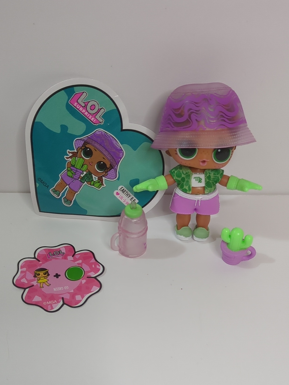 L.O.L. Surprise! Purple Bucket Hat Doll with Green Accents and Pink Bottle